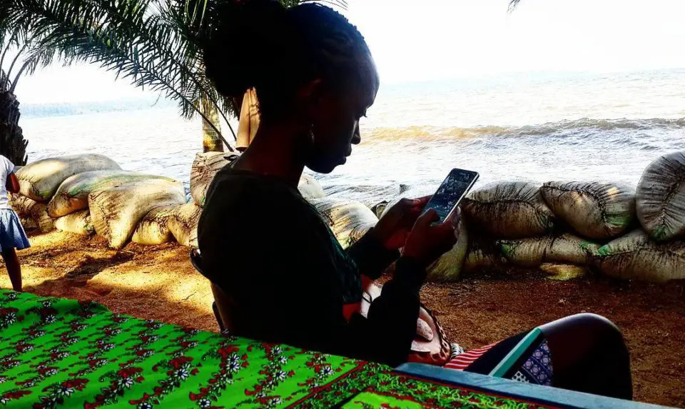 My cousin on the shores of Lake Victoria