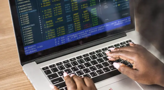 Woman working on a laptop at a cyber cafe near me