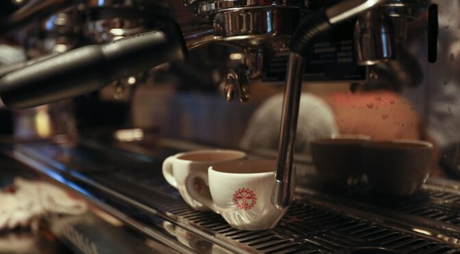 A cofee cup in a coffee machine at java junction mall