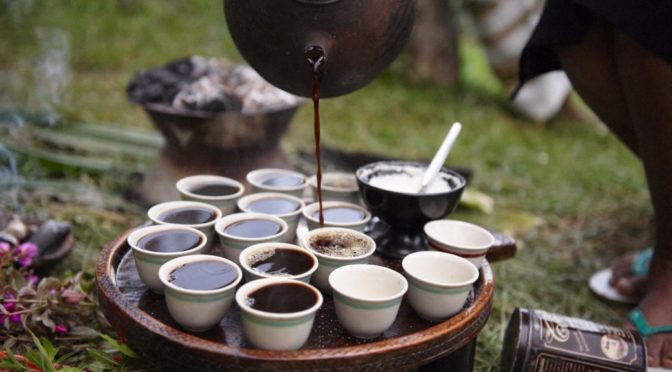 Pouring coffee during an Eritrean coffee ceremony