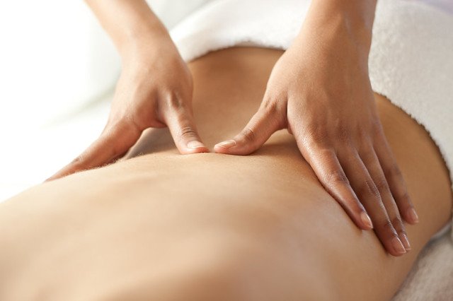 A back being massaged
