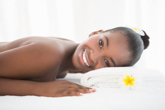 Black woman waiting for beauty treatment to begin - massage dar es salaam tanzania
