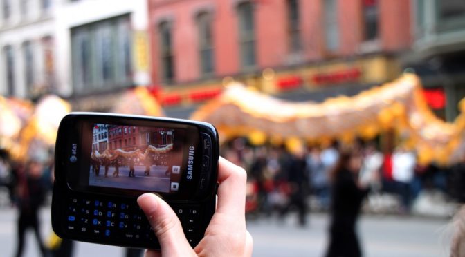 Mobile phone taking a picture of China Town