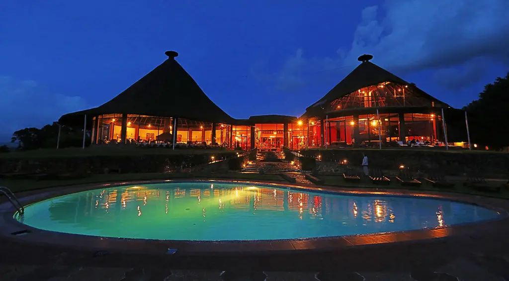 Ngorongoro Sopa Lodge Images -- the pool and restaurant by night