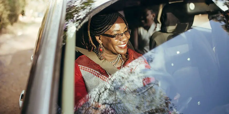 A Tanzanian woman drives an Uber