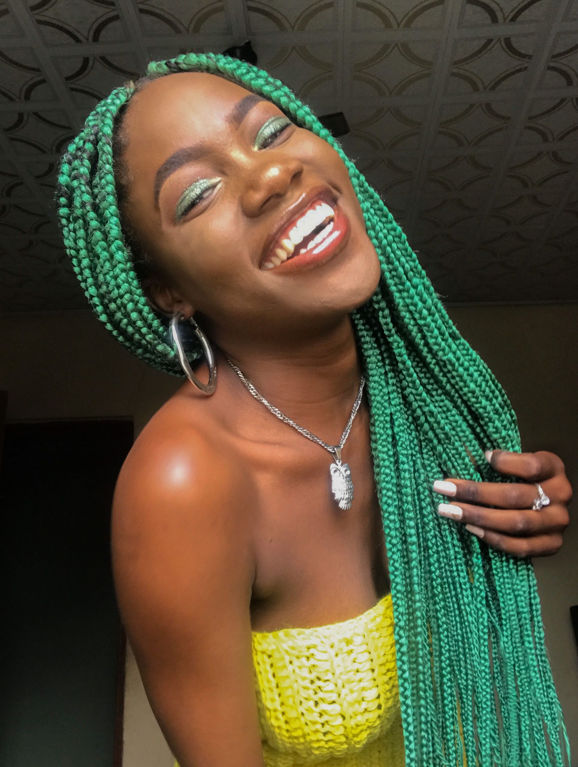 Laughing Girl with Green Braids on Dark Skin