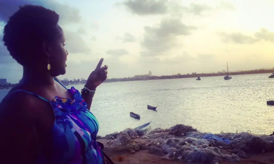 Pointing at Sunset over Msasani Bay, Dar es Salaam Tanzania. You can also get to Mbudya from Slipway.  (There Are No Flights to Mbudya Island)