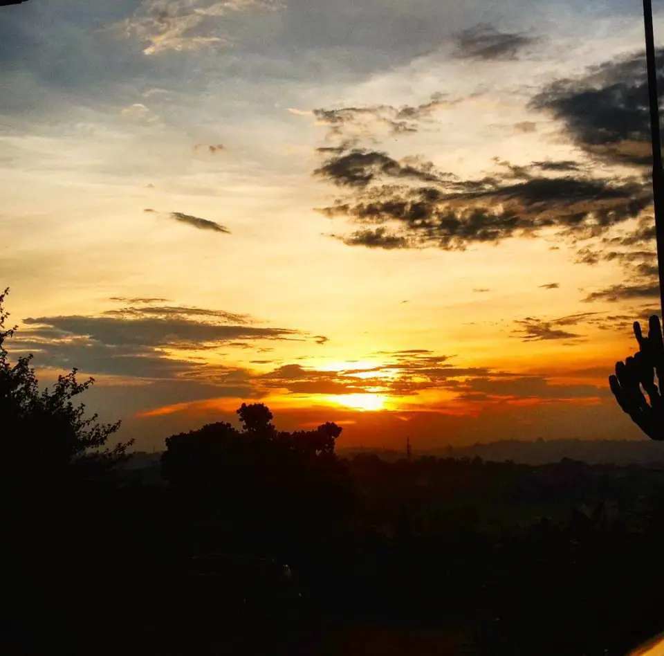 The sun sets over Mutungo Hill, Kampala seen from Afrique Suites Hotel.