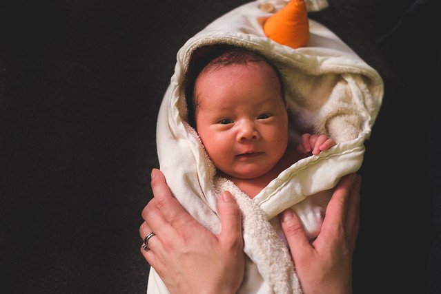 Baby in a hooded towel