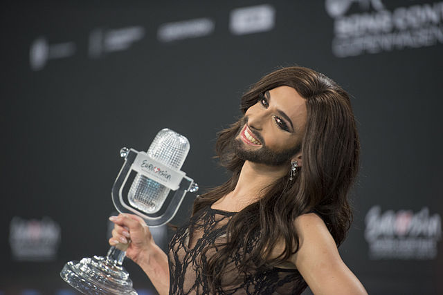 A bearded man in a dress at Eurovision