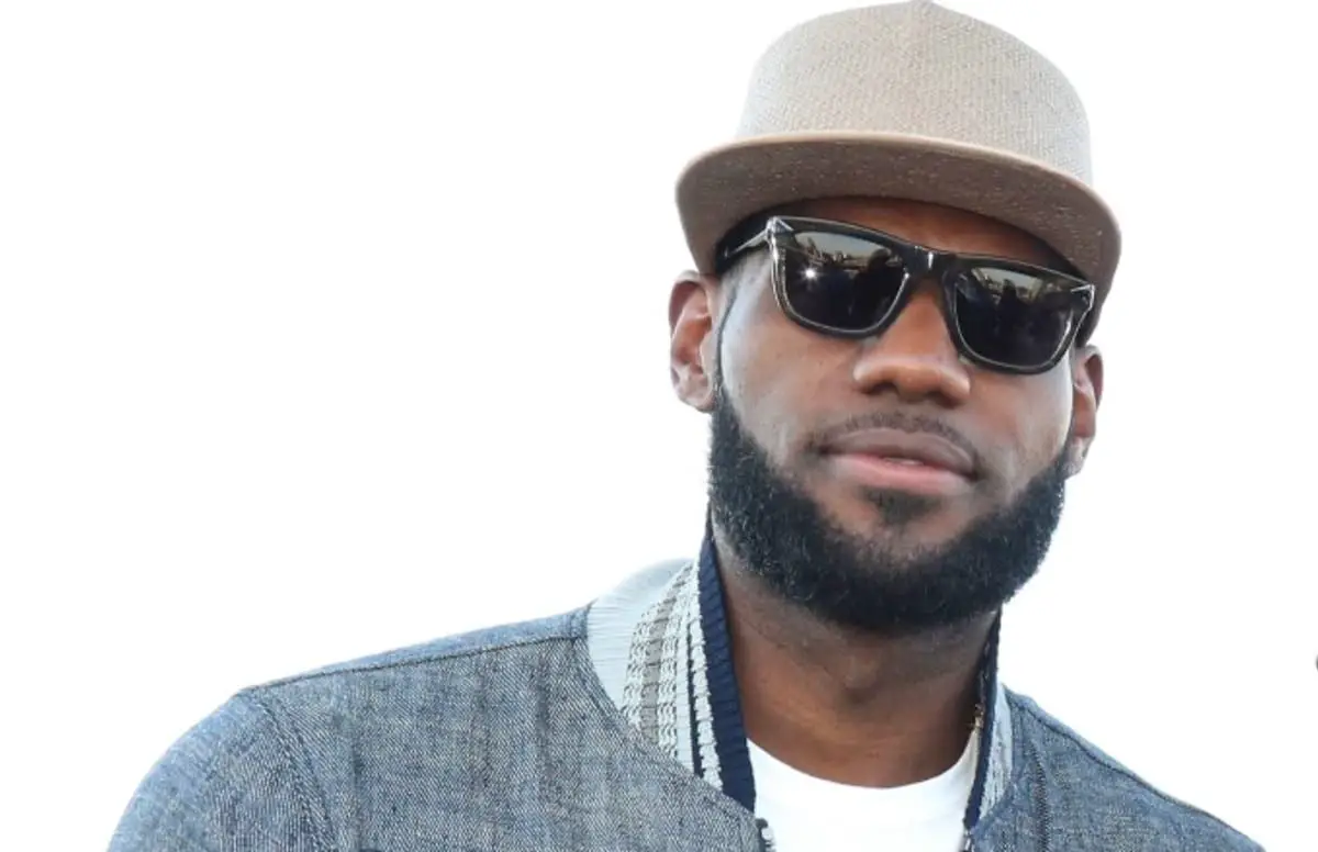 LeBron James with a beard a hat and dark shades