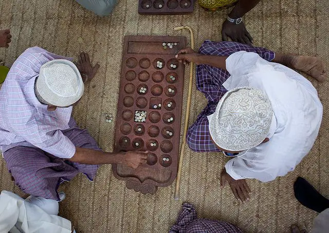 traditional games in Kenya: Men playing Bao in Lamu