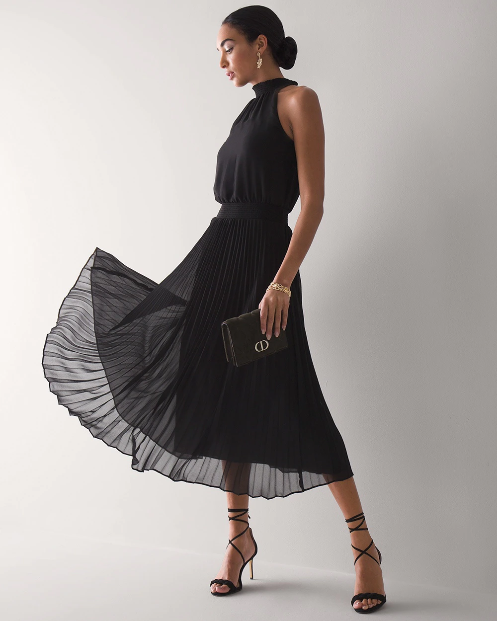 a black cocktail wedding guest dress