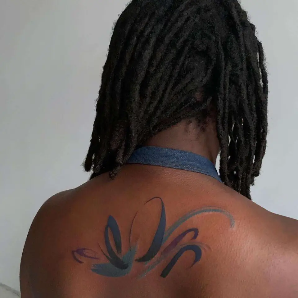 Water color tattoos on dark black skin