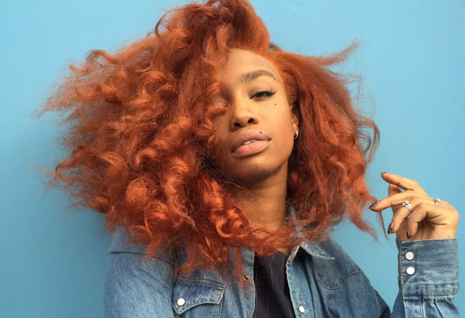 the best hair color for brown skin: a reddish copper