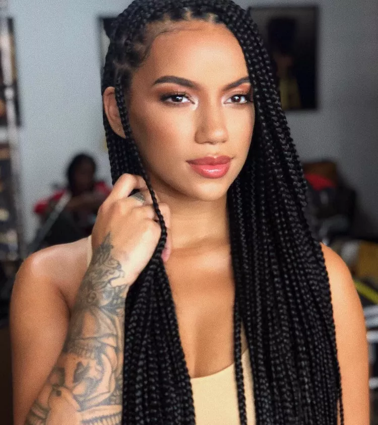 How.Long Do Box Braids Last?: a light skinned woman with box braids